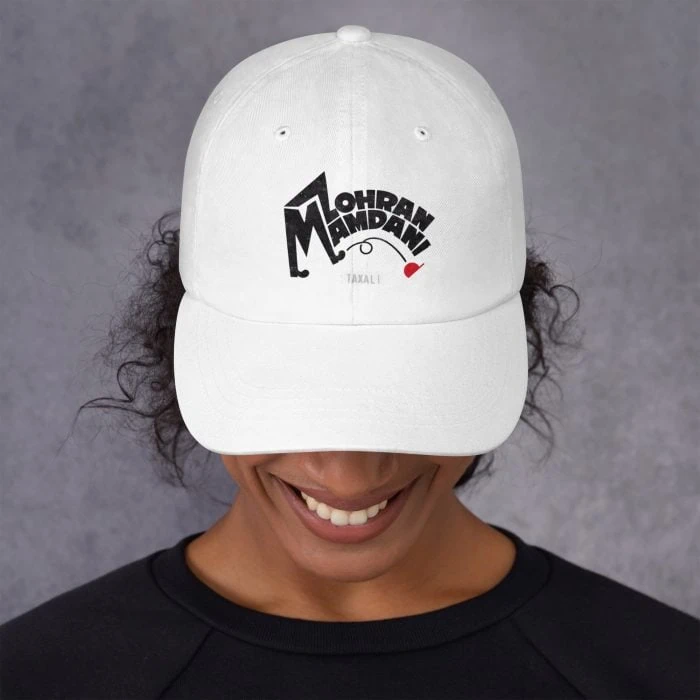 classic-dad-hat-white-front-692f4566a1aba.jpg GARY TAXALI “MAMDANI KICKS” DAD HAT - pop art apparel by Canadian artist Gary Taxali
